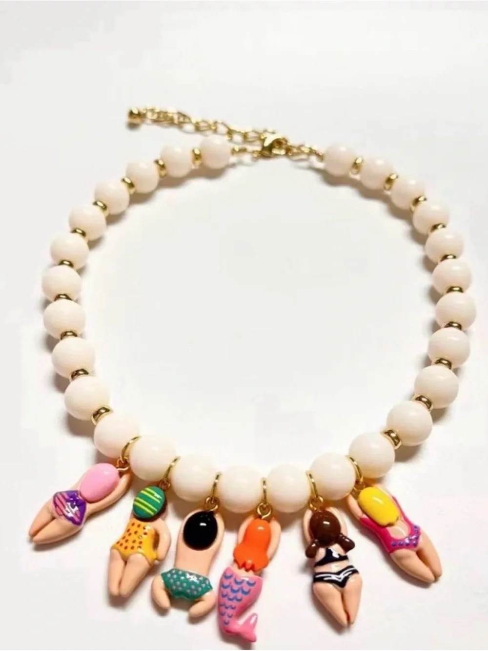 Anthropologie White Beaded Necklace with Colorful Swimmer & Mermaid Charms